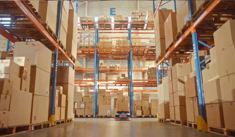Robots carrying storage boxes in an automated warehouse